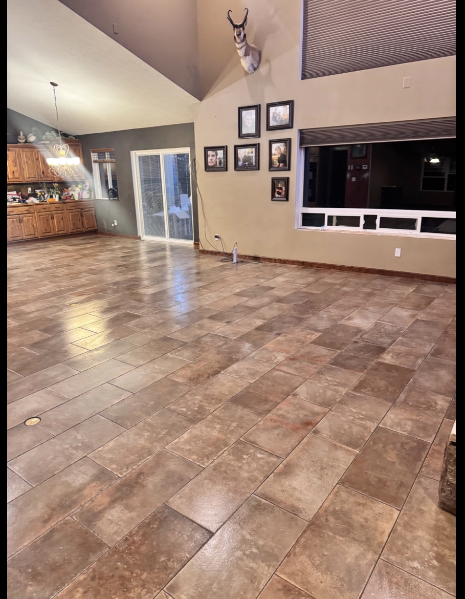 Large tiled great-room floor with herringbone border accent